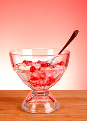 some coctail with pomegranate in glass with spoon