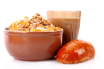 Bowl with muesli, milk and loaf isolated on white