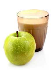 Glass with milk and green apple isolated on white