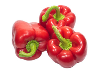 Three red sweet peppers isolated on white