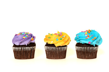 Three colorful cupcakes