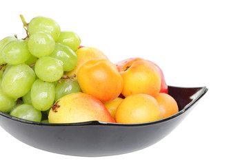 grape, pear and apricot kept in bowl