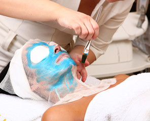 woman getting a beauty mask