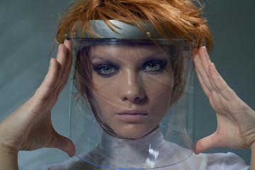Serious clever woman in glass mask