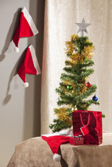Christmas tree with parephernalia of Xmas around it