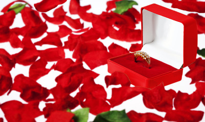 Beautiful Diamond Ring in a Red Jewelry Case on Rose Petals