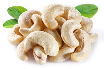 Cashew with leaves on white background