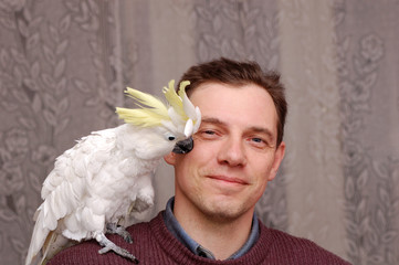 Man with parrot sitting on the shoulder © Art_man