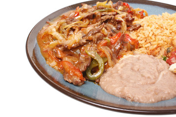 Steak fajitas with beans and rice.
