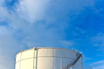 white tanks in tank farm with snow in winter
