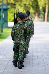Soldiers in camouflage marching