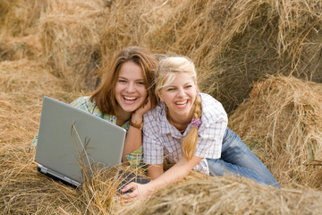 Naklejka na ściany i meble girls with notebook in farm