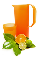 Pitcher and glass with orange and lime