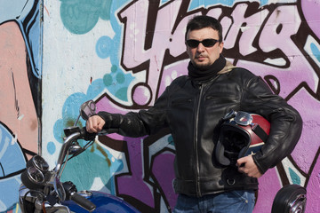 Fototapeta na wymiar A Motorcycle Rider and his Custom Bike