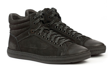 Pair of black male sports shoes on white background