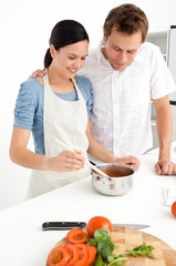 Lovely couple preparing a bolognese sauce together