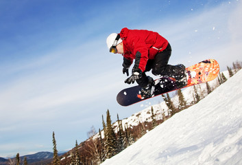 Snowboarder jumping