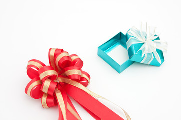 red ribbon with cyan gift box on white background