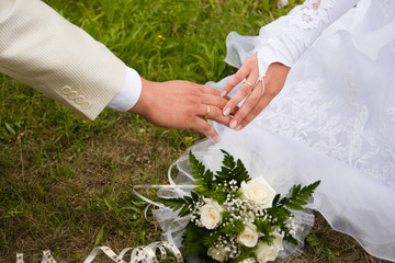 the bride and groom holding hands