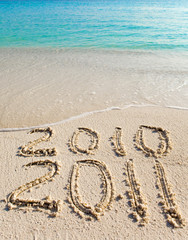 New 2011. The wave washes off an inscription 2010.