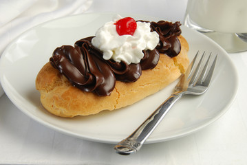 An eclair with a cherry
