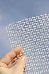 Detail of glass-fiber mesh – reinforcing material for insulation