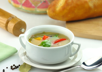 vegetable soup in a white soup cup