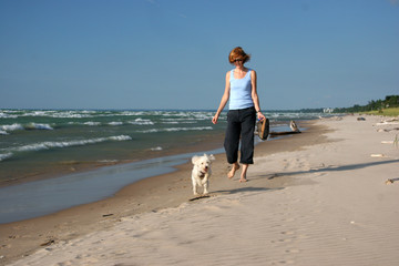 Woman and dog on the beach - Pinery, Lake Huron, Ontario