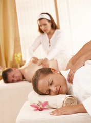 Fototapeta na wymiar Couple having massage in spa