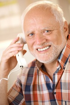 Older man on landline phone call