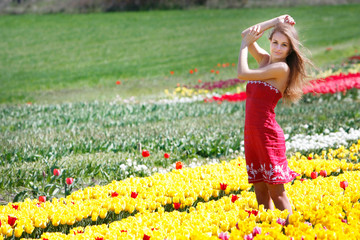 young attractive woman in tulip field
