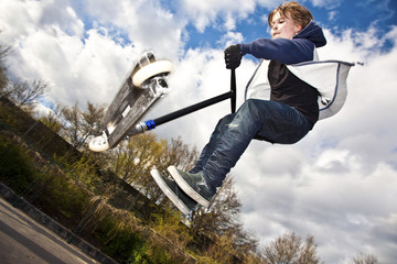 child going airborne with his scooter © travelview