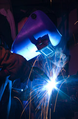 MIG welding of metal cylinder - obrazy, fototapety, plakaty