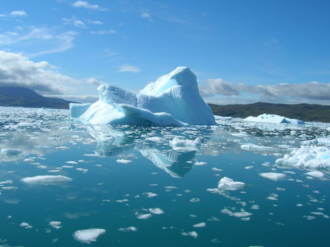 Melting icebergs by the coast of Greenland,