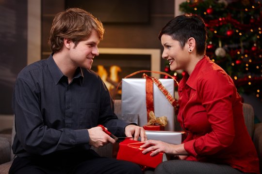 Young couple preparing for christmas eve