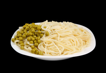 White plate with pasta and green peas isolated
