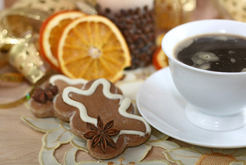 Obraz na płótnie Canvas coffe, oranges and gingerbreads with spices