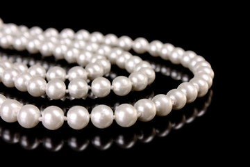 White pearls on  black  background
