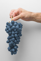 Hand with grape