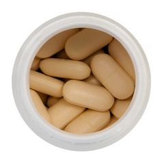 Pills in pot - overhead view, isolated