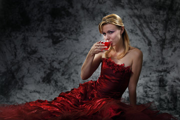 Naklejka premium The girl with a wine glass