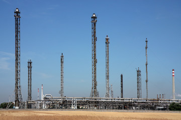 pipes and chimney in oil refinery and agriculture field