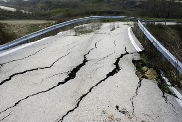 Closed-up cracked asphalt after earthquake - 28363477