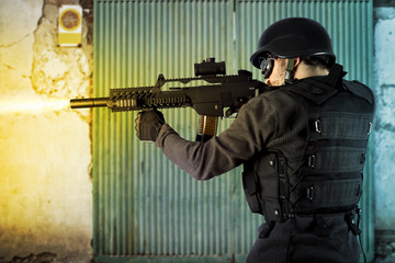 Fototapeta premium Street Assault, riot police firing his submachine gun