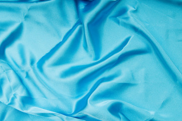 Bright satin fabric folded to be used as background