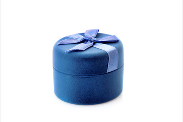 Gold  engagement ring in box on the flowers background