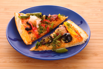Pizza with  salami on the plate