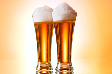 Beer glasses against the colorful gradient background
