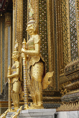 Obraz premium Golden statue guards at Grand Temple in Bangkok, Thailand
