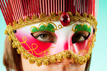 Attractive woman posing in the stylish mask